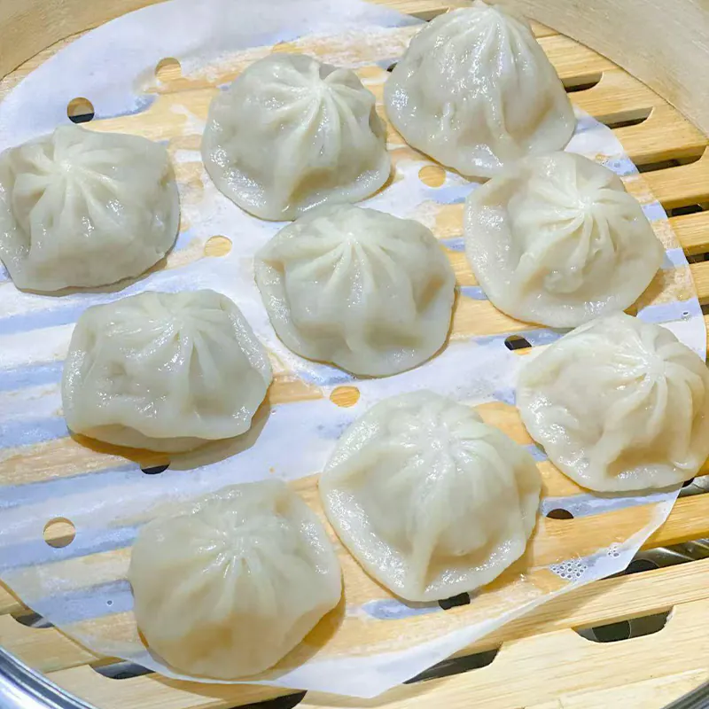 Liuzhou rice noodles (Luosifen) with spicy broth, bamboo shoots, peanuts, and herbs.